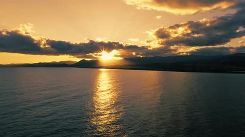 Golden Sunset Over Calm Ocean Waters