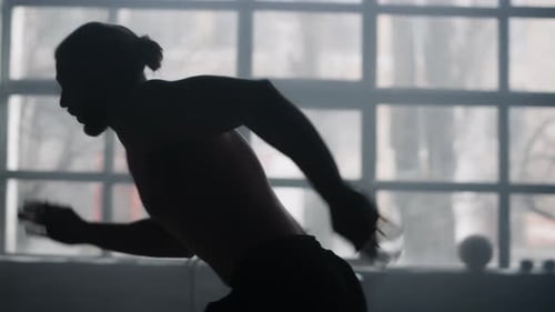 Active Man Running in Sport Gym. Male Runner Doing Cardio Workout In