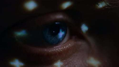 Biometric Facial Recognition Scanning of Blue Eye's Iris. Futuristic Concept: Projector Identifies