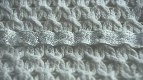 Macro of White Woven Fabric with Silver Thread