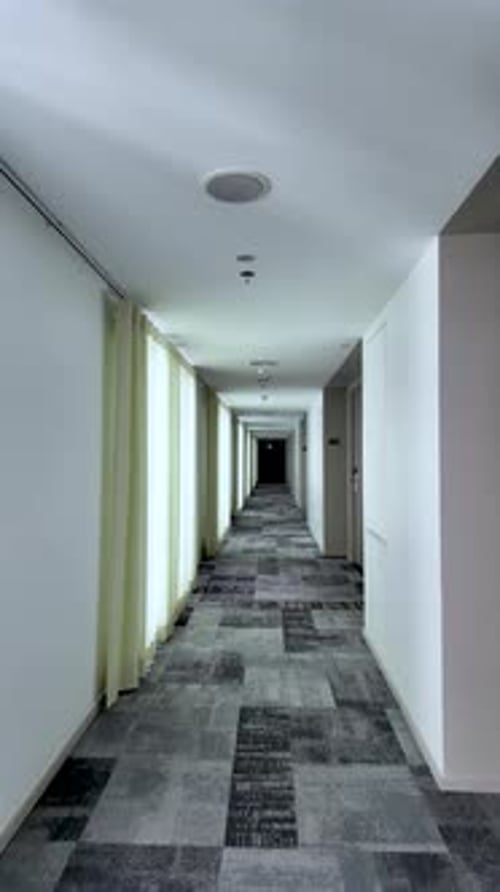 Quiet Hotel Corridor With Long Hallway, Curtains, And Subtle Lighting For Travel Stay