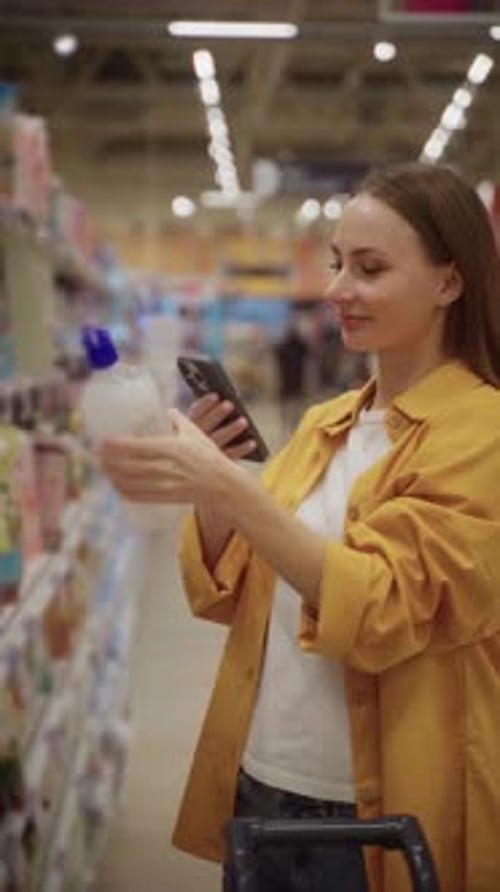 Scanning Liquid Soap Products in a Retail Store for Price and Details While Shopping