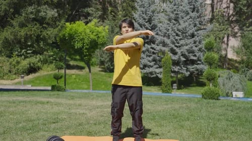 Young Adult Exercises and Stretches in Sunny Park
