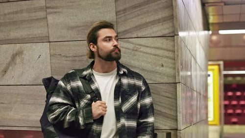 Handsome Man Wearing Casual Clothes Standing in Subway