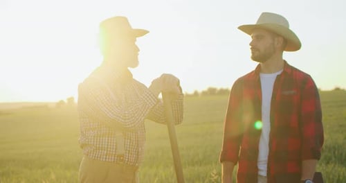 Full Length View of the Senior Farmer Engineer Coaching Young Intern Farming Technologies Mature