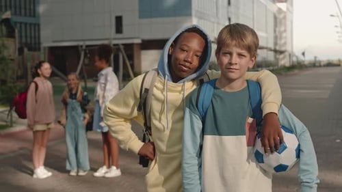 Children Standing Together in Front of School Building