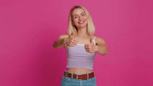 Woman Smiling and Giving Thumbs Up Gesture