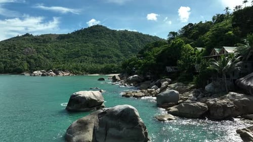 Koh Phangan Rocky Coastline: Turquoise Waters and Lush Green Hills
