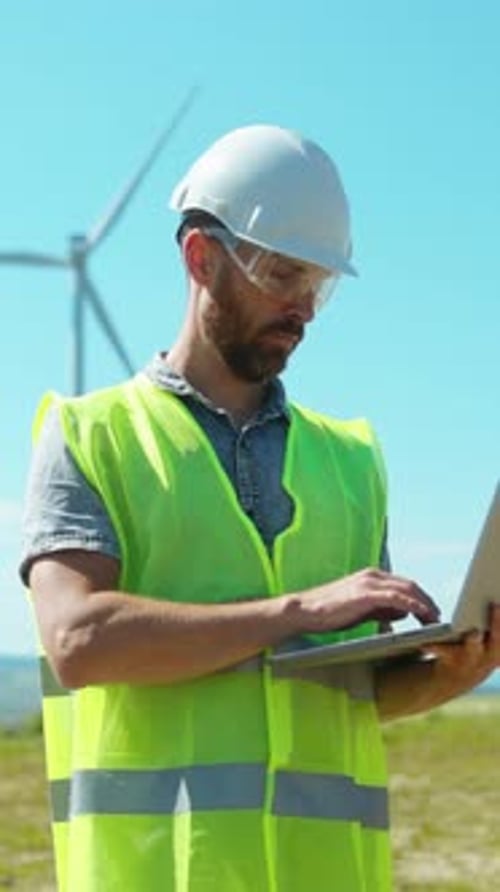 A Construction Worker Uses a Tablet Outdoors Showcasing Technologys Role in Modern Projects