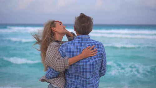 Romantic Middleaged Couple Enjoying a Peaceful Evening Together on the Beach Love Connection and