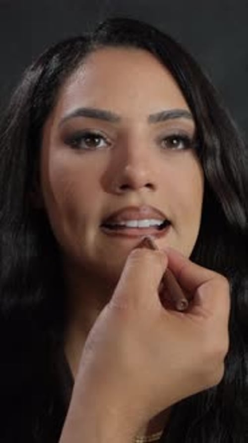 Woman Applies Lip Liner in Close Up Shot