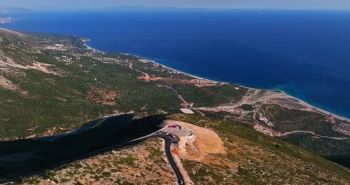 Aerial tracking shot of the Panorama Llogara viewpoint, golden hour in Albania