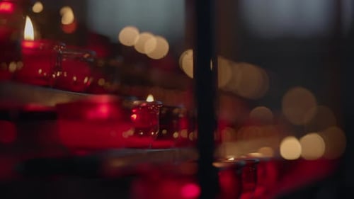 Red Votive Candles Burning in Soft Light