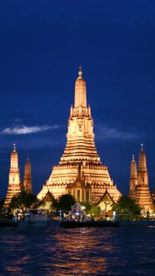 Stunning Illuminated Wat Arun Temple Glows Against the Night Sky in Bangkok Thailand