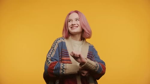 Happy Teen Dances with Pink Hair and Braces