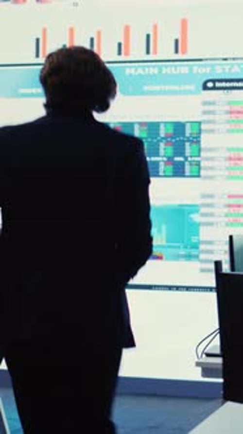 Vertical Video Pleased General Director Showing Statistics Data Flyers to His Team