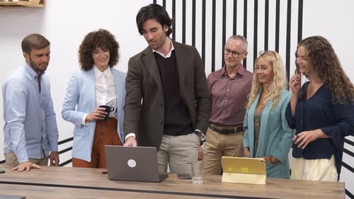 Cheerful Team Applauding for Businessman After Presentation in Office