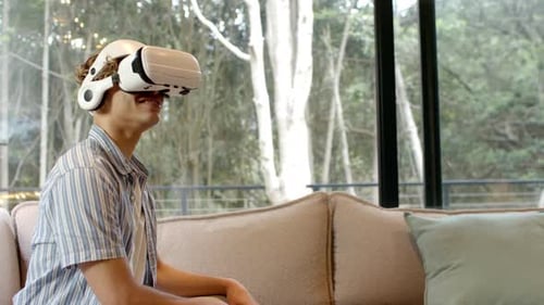 Young Man Immersed in Virtual Reality Experience