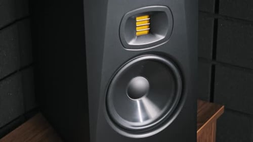 Studio Monitor Speaker Vibrates From Bass Music in a Recording Studio CloseUp
