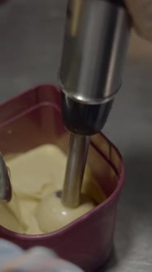 Close up of blender mixing yellow liquid