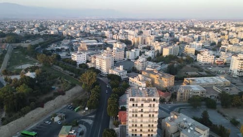 Aerial view of the evening city from above. High-rise building and urban development.