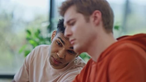 Young Adults Collaborate in a Modern Office