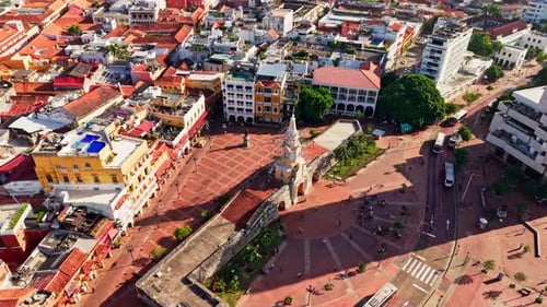 orbit shot of cartagena clock tower plaza in slow motion aerial view