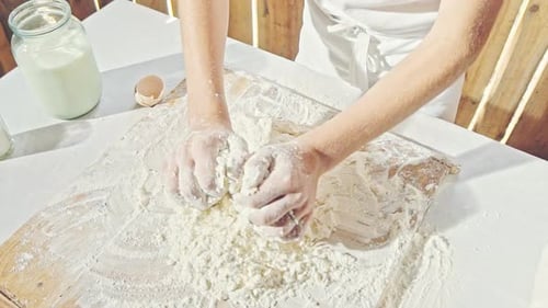 Young Boy Kneading Pastry Dough for Baking