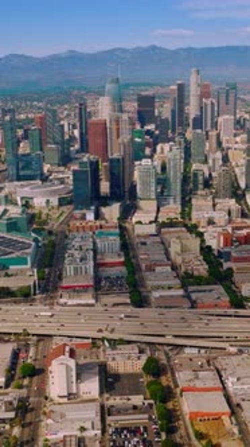 Travel aerial view of urban los-angeles buildings. Modern city downtown los angeles. Vertical video