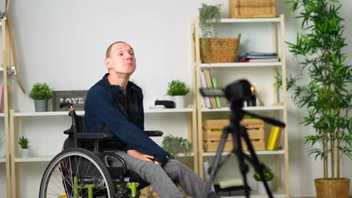 Man in Wheelchair Recording Video for Blog