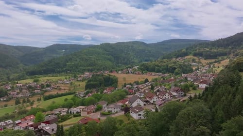 Aerial Footage of German Village and Forested Landscape