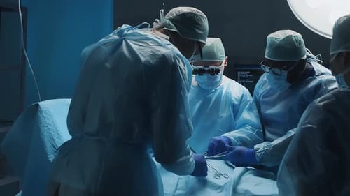 Surgeons Performing Operation in Hospital Operating Room