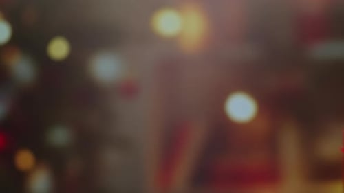 Hands Exchanging a Birthday Gift with Bokeh