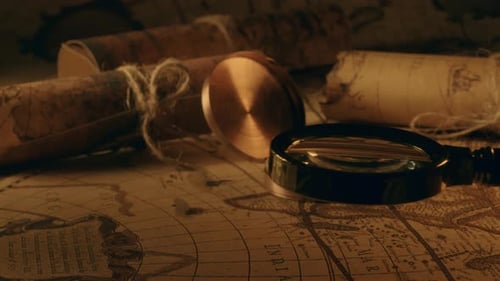 Antique Maps and Scrolls with Compass and Magnifier