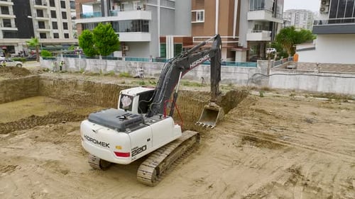Building Foundations Aerial of Excavators and Trucks at Work