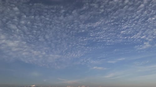 Altocumulus Cloud Formations in Blue Sky – Atmospheric Patterns and Weather Texture