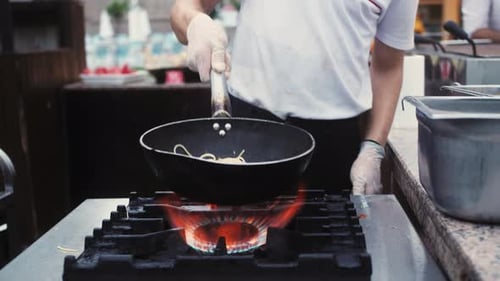 Chef Preparing Pasta on High-Powered Gas Stove