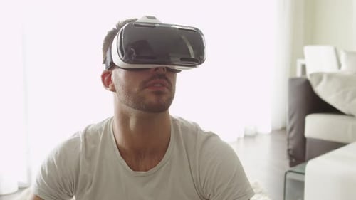 Man Wearing VR Headset in Bright Living Room