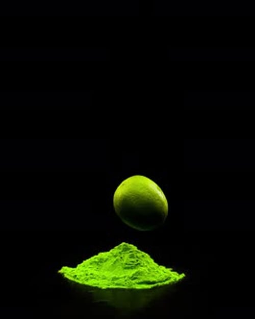 Super Slow Motion of a Falling Lime in Holi Colors or in Colored Powder