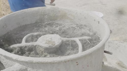 Mixing Cement and Concrete in an Industrial Mixer