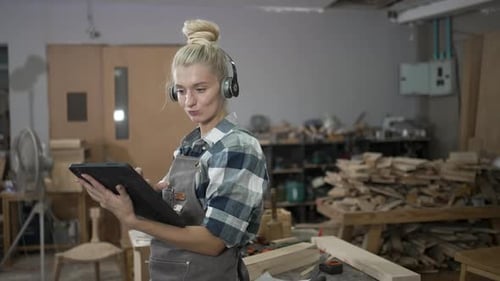 Carpenter is working at workshop.
