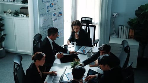 Top view of smart manager looking at financial statistic on tablet. Directorate.