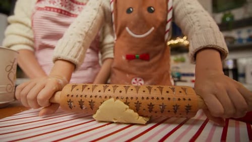 Small Kid Helping Mom to Bake Xmas Biscuits Close Up Hands Holiday Concept