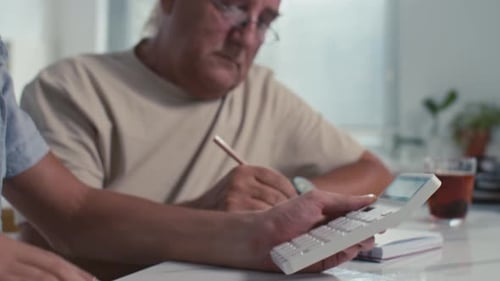 Teen Helps Senior with Finances at Home