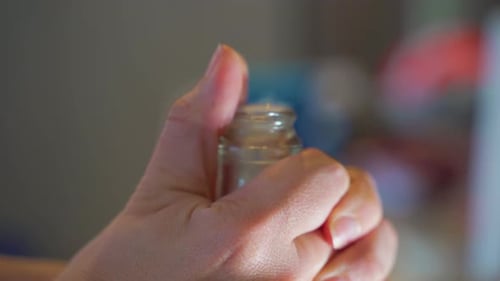 Close up of hand and cork being popped on a bottle of Champagne/Prosecco/Bubbly/Sparkling wine.