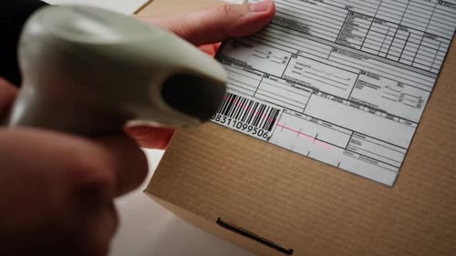 Scanner Scan Delivery Box in Storage Ecommerce Shop Man Packing Goods and Clothes Second Hand