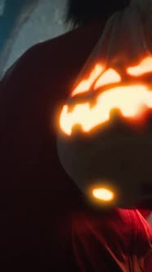 Monster Walks With Bag Containing Halloween Pumpkin Among Tree Forest And Fog