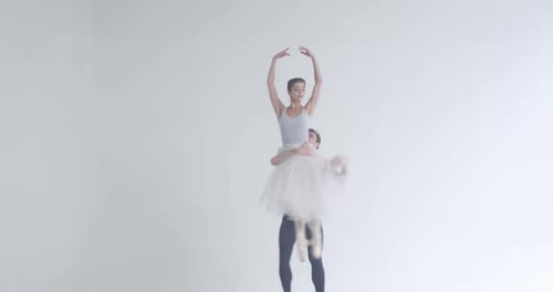 Ballet Dancers Perform in a White Studio