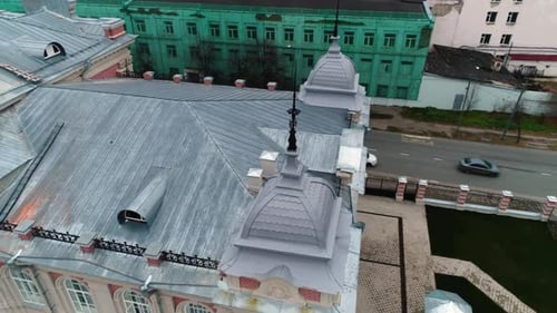 Elegant Domes with Spires on Tin Roof of Historical Building