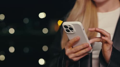 Young Adult Using Smartphone at Night